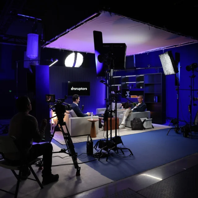 Behind the scenes on the Disruptors podcast set. An overhead diffusion frame keeps the light soft on both chairs while the rest of the stage stays dark and on brand. Planning a video podcast for your company? We build the set, light it and shoot it.

#fivesixpodcast #videopodcast #podcastproduction #behindthescenes #lasvegasvideoproduction #fivesixpodcast